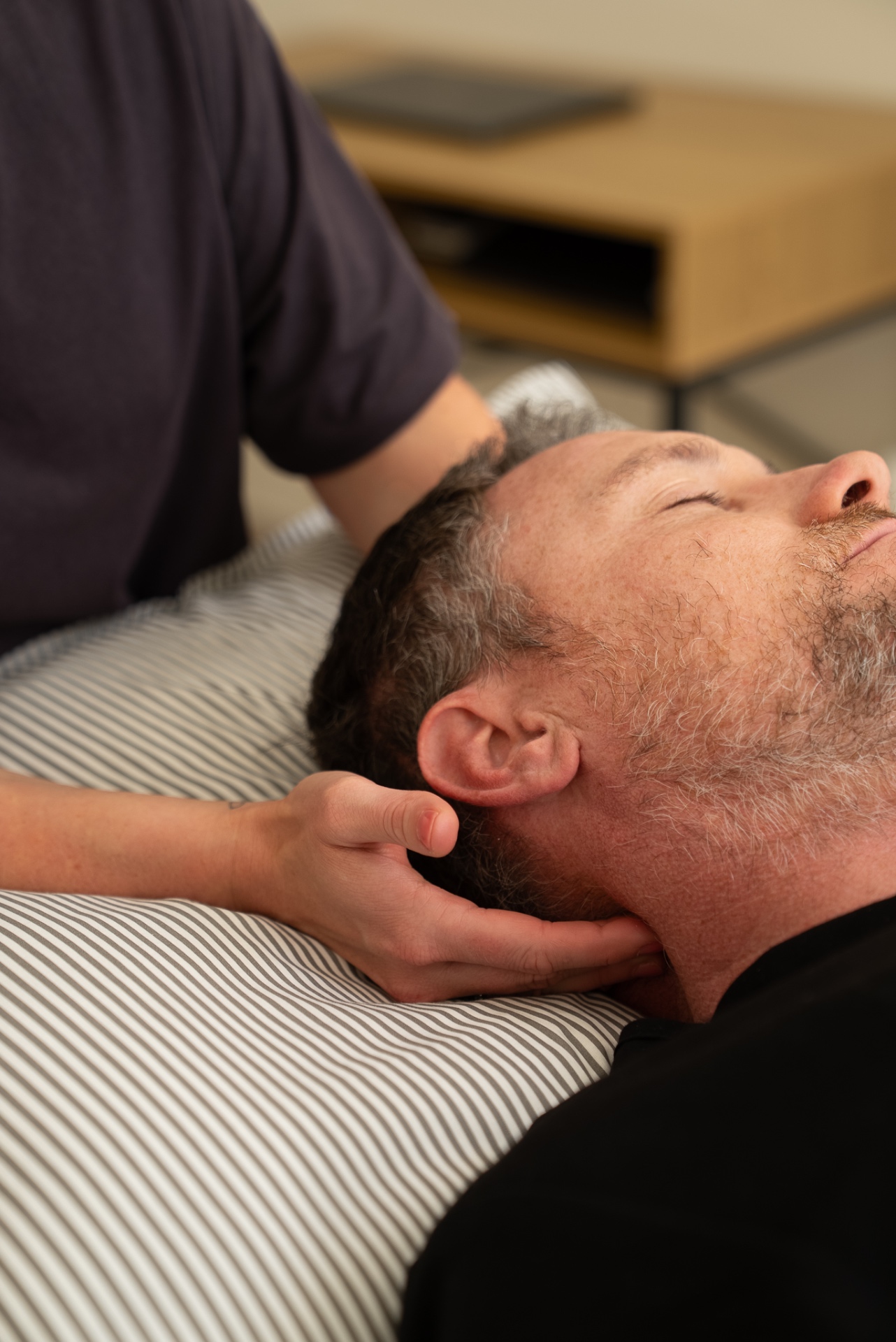 Hands-on manual therapy technique to the cervical spine during a physiotherapy session at Physio Flora on the Costa del Sol