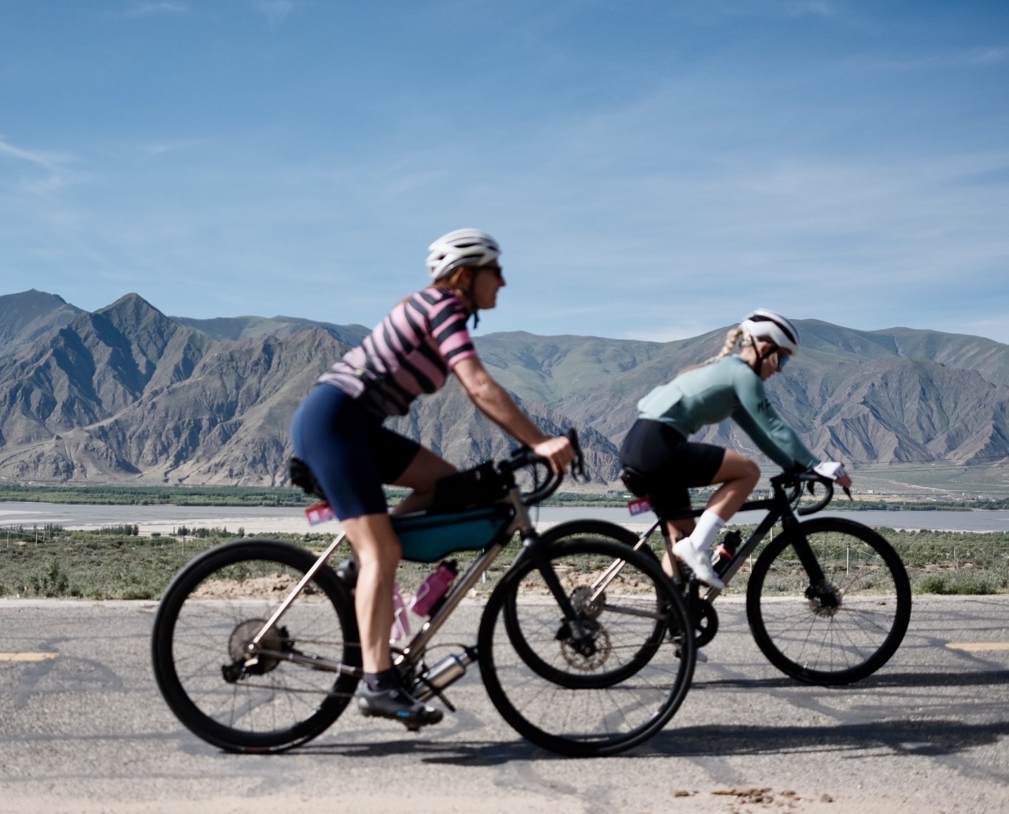 Flora Muijzer cycling through the Tibetan mountains at high altitude, en route to Mount Everest Base Camp at 5,400 metres